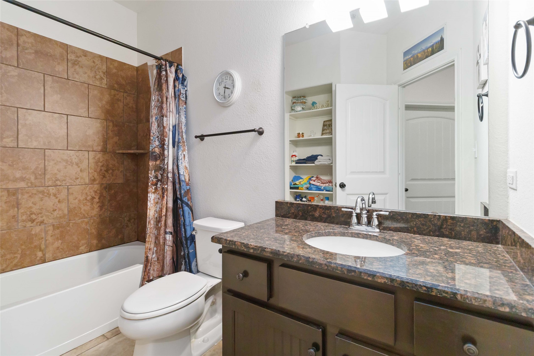 1193 Persimmon Pass Fischer, TX 78623 - Photo 16 of 27 a bathroom with a granite countertop sink toilet and shower