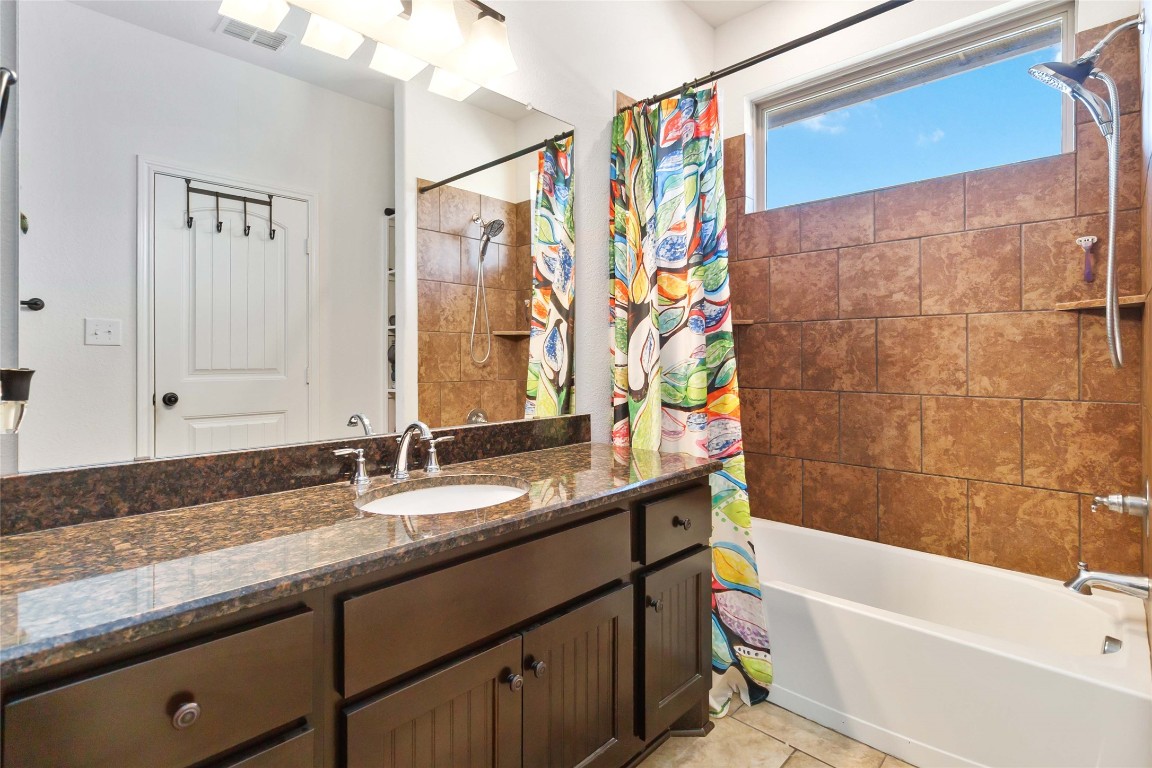 1193 Persimmon Pass Fischer, TX 78623 - Photo 19 of 27 Full primary bathroom featuring vanity, shower / tub combo