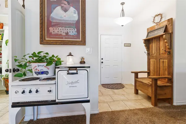 a view of kitchen with cabinets and stove
