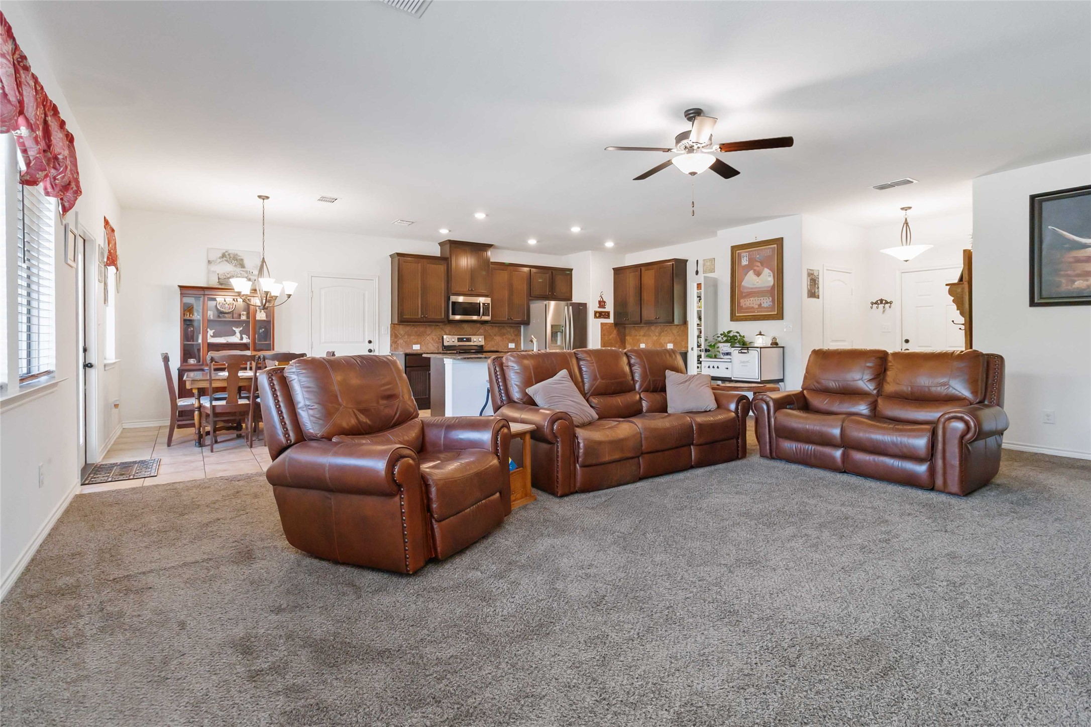 1193 Persimmon Pass Fischer, TX 78623 - Photo 6 of 27 a living room with furniture and a chandelier