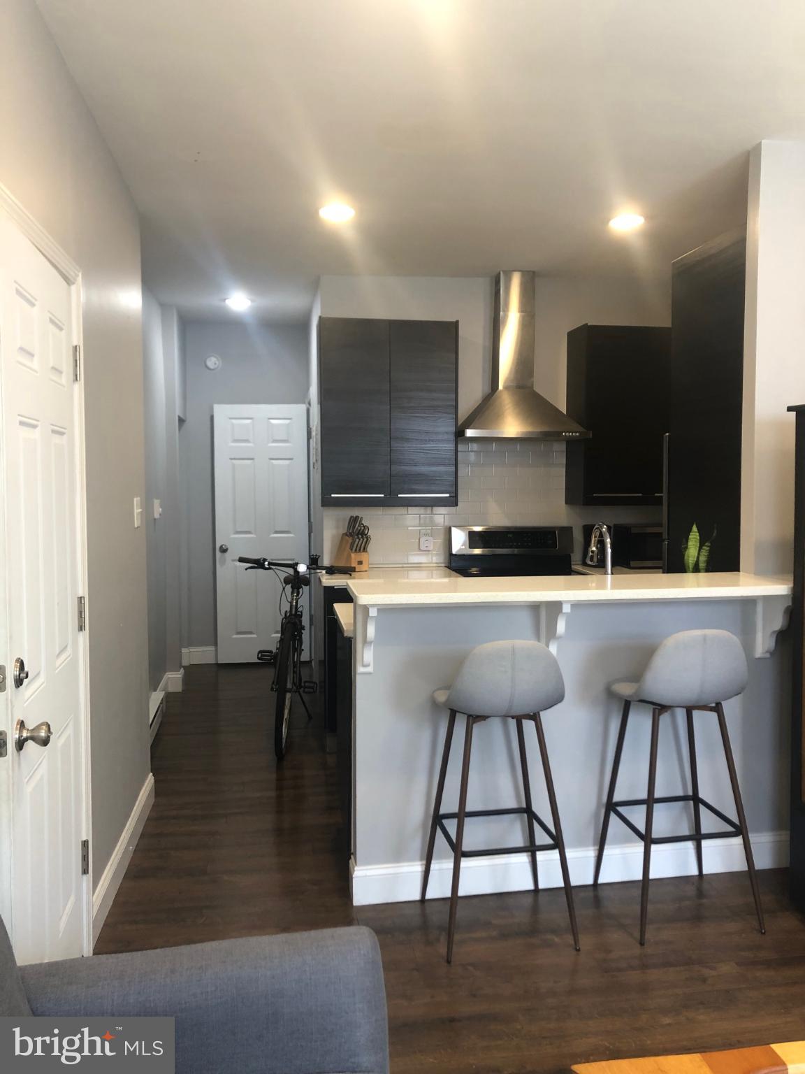 349 Dickinson Street, Unit 1 Philadelphia, PA 19147 - Photo 8 of 11 Modern kitchen with sleek finishes.