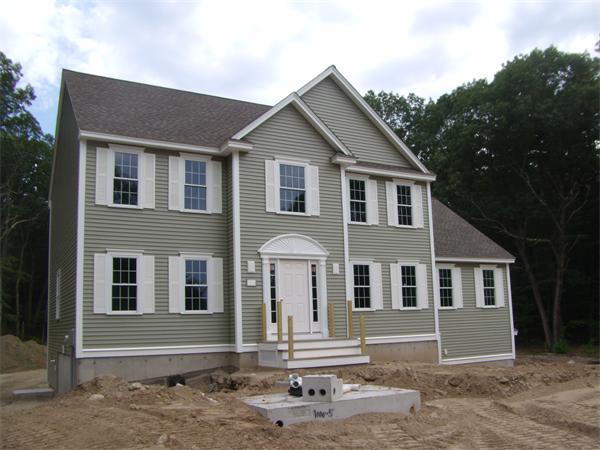 166 Harvard Road Littleton, MA 01460 - Photo 1 of 5 a front view of a house with a yard