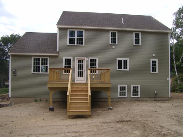 166 Harvard Road Littleton, MA 01460 - Photo 2 of 5 a front view of a house with a yard