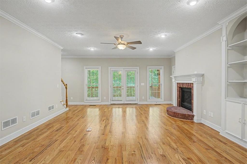 1136 Cole Lake Road Dallas, GA 30157 - Photo 14 of 72 a view of wooden floor and a chandelier in a room