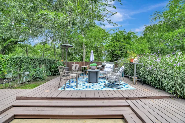 a view of backyard with sitting area
