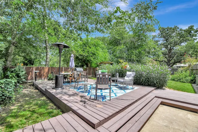 a view of a table and chairs on the roof deck