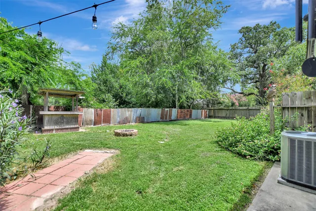 a backyard of a house with lots of green space