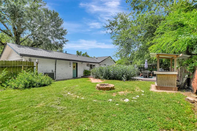 a view of a backyard with a garden and plants