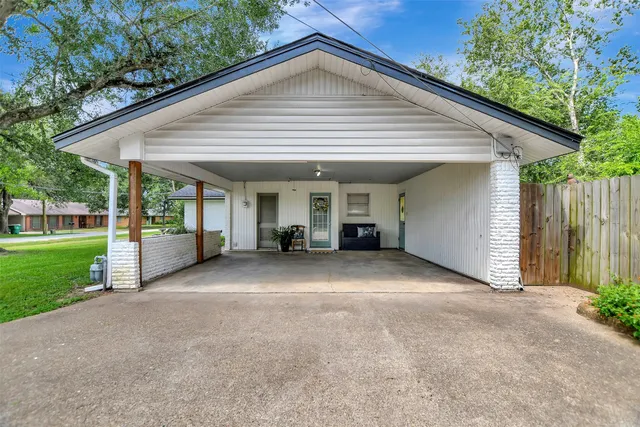 a view of a house with a yard and garage