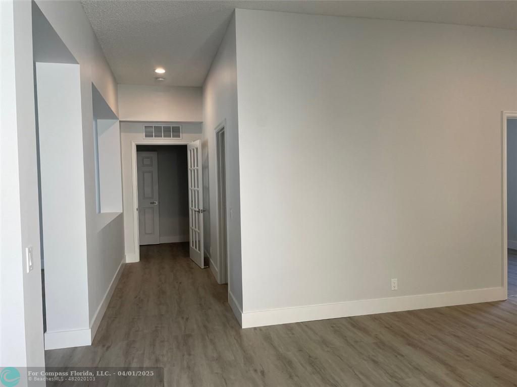 4293 Laurel Ridge Circle Weston, FL 33331 - Photo 12 of 63 a view of hallway with wooden floor