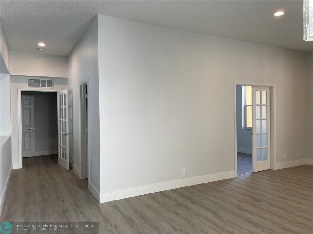 4293 Laurel Ridge Circle Weston, FL 33331 - Photo 13 of 63 a view of an empty room with wooden floor and closet