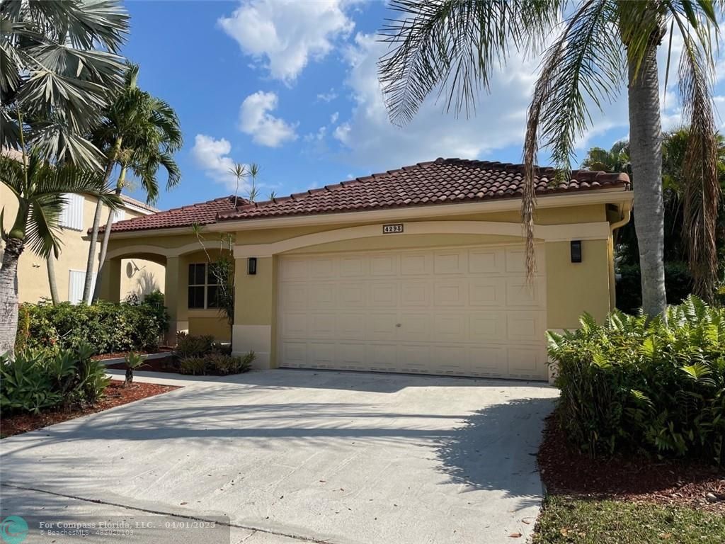 4293 Laurel Ridge Circle Weston, FL 33331 - Photo 2 of 63 a front view of a house with a yard