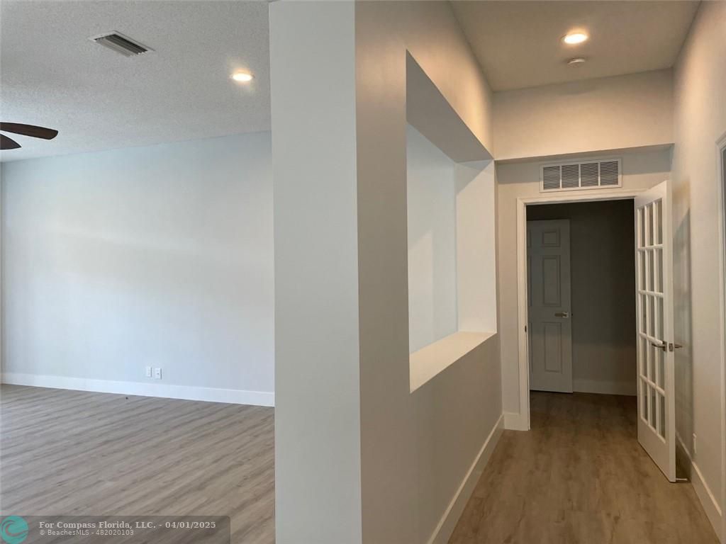 4293 Laurel Ridge Circle Weston, FL 33331 - Photo 28 of 63 a view of hallway with wooden floor