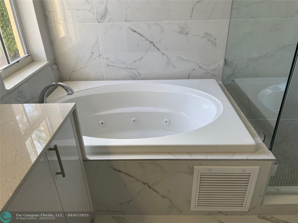 4293 Laurel Ridge Circle Weston, FL 33331 - Photo 35 of 63 a bathroom with a bathtub