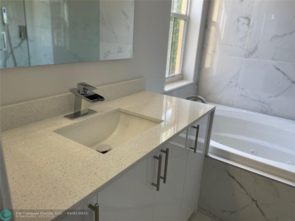 4293 Laurel Ridge Circle Weston, FL 33331 - Photo 38 of 63 a bathroom with a sink and a bathtub