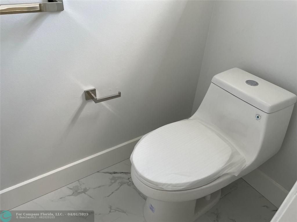 4293 Laurel Ridge Circle Weston, FL 33331 - Photo 39 of 63 a close up of a toilet in a bathroom