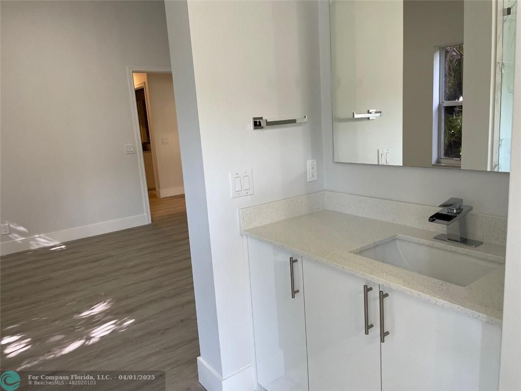 4293 Laurel Ridge Circle Weston, FL 33331 - Photo 40 of 63 a bathroom with a sink and a mirror