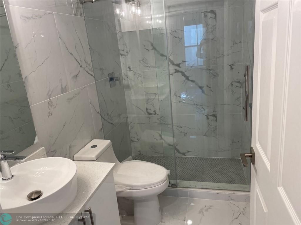 4293 Laurel Ridge Circle Weston, FL 33331 - Photo 47 of 63 a bathroom with a sink toilet and shower