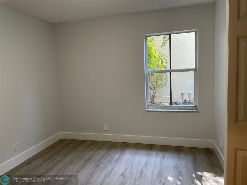 4293 Laurel Ridge Circle Weston, FL 33331 - Photo 48 of 63 a view of a small space with wooden floor and a window