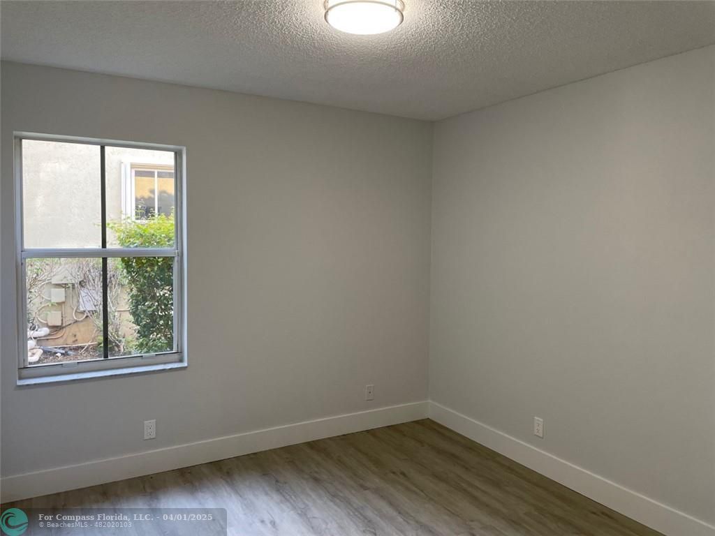 4293 Laurel Ridge Circle Weston, FL 33331 - Photo 51 of 63 an empty room with a window