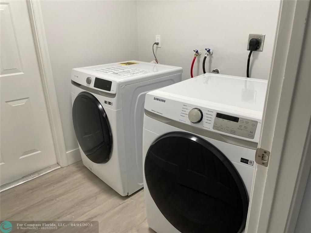 4293 Laurel Ridge Circle Weston, FL 33331 - Photo 52 of 63 a utility room with dryer and washer