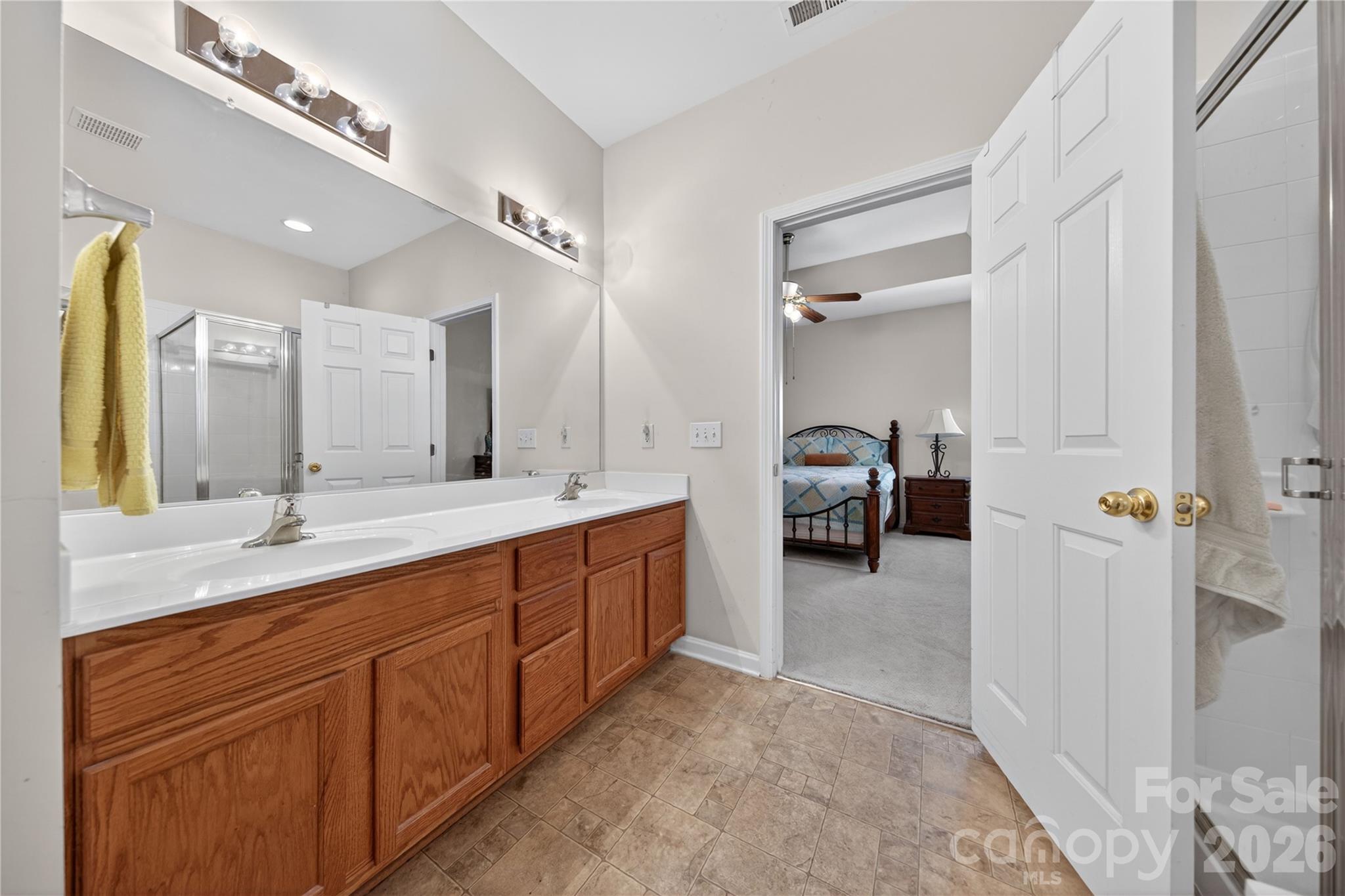 533 Fair Oaks Drive Fort Mill, SC 29708 - Photo 20 of 33 a en suite bathroom with a double vanity sink and a mirror