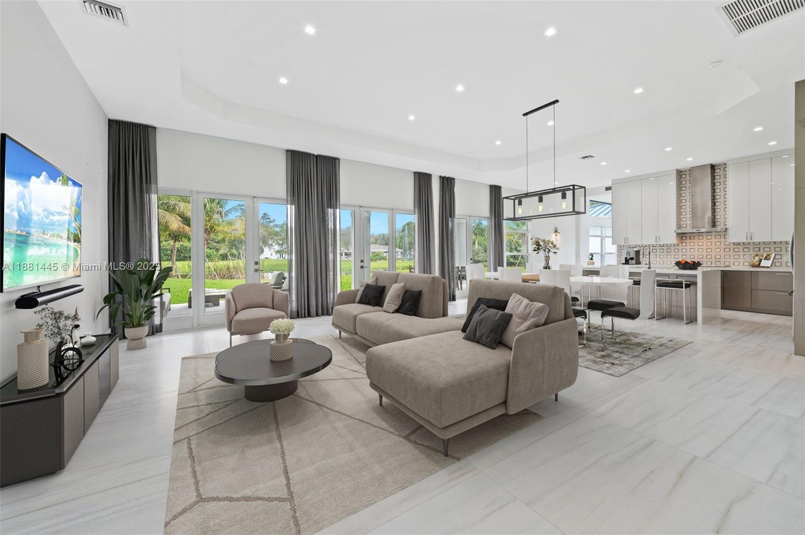 2400 Southwest 112th Avenue Davie, FL 33325 - Photo 12 of 61 a living room with furniture and a flat screen tv