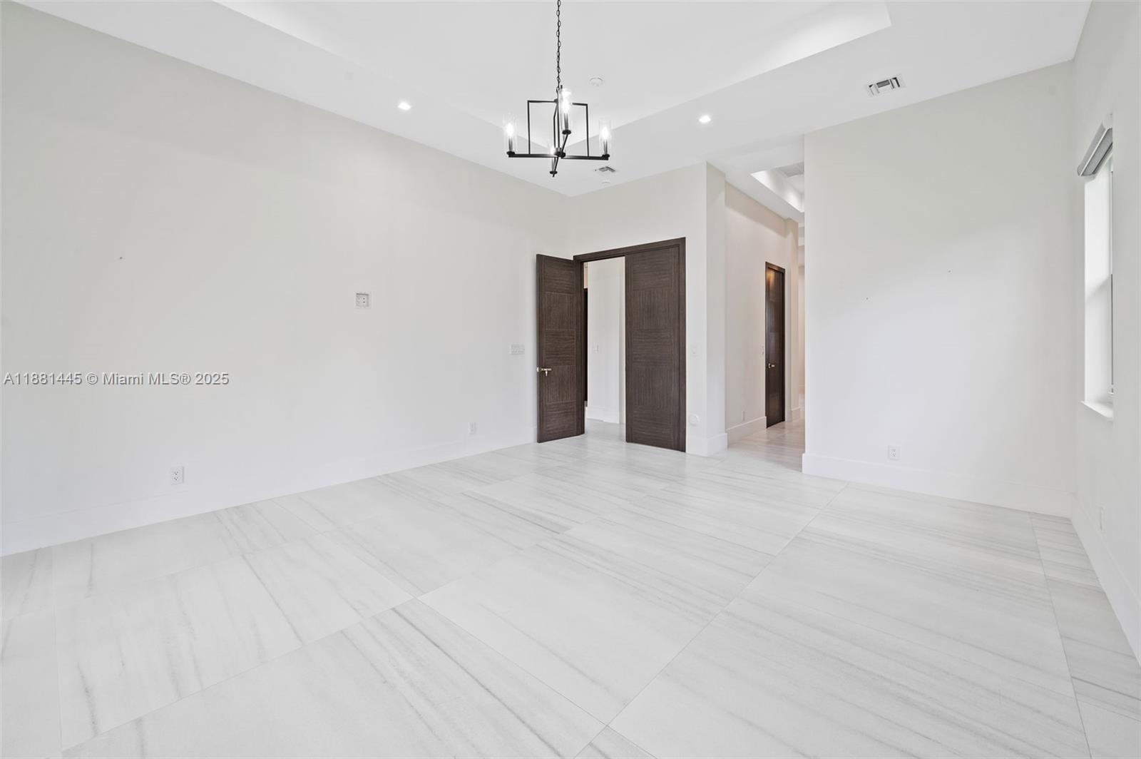 2400 Southwest 112th Avenue Davie, FL 33325 - Photo 29 of 61 a view of an empty room with chandelier fan and window