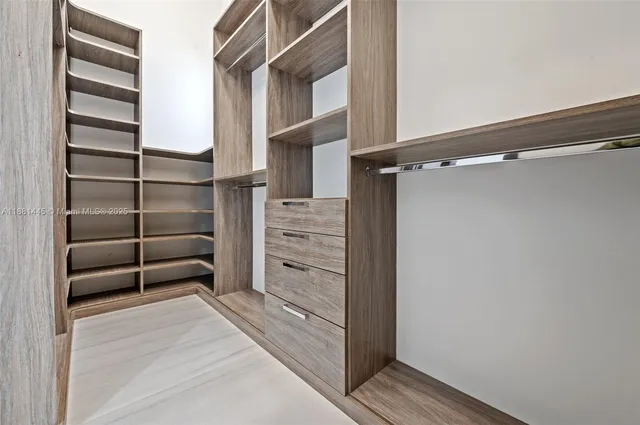 a bathroom with a double vanity sink mirror and bathtub