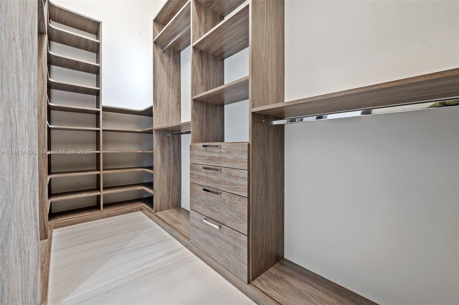 2400 Southwest 112th Avenue Davie, FL 33325 - Photo 30 of 61 a view of walk in closet with empty racks