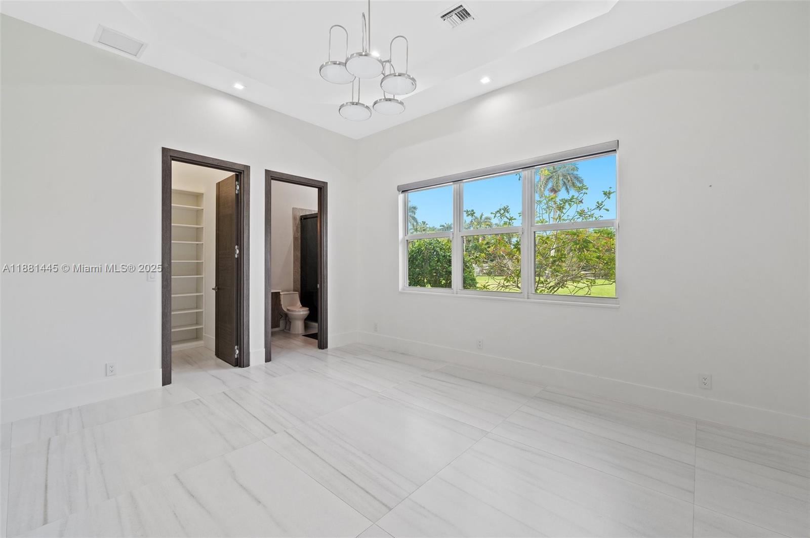 2400 Southwest 112th Avenue Davie, FL 33325 - Photo 34 of 61 wooden floor in an empty room with a window