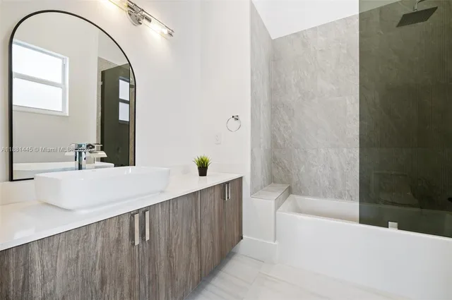 a view of a patio with a table chairs and a backyard