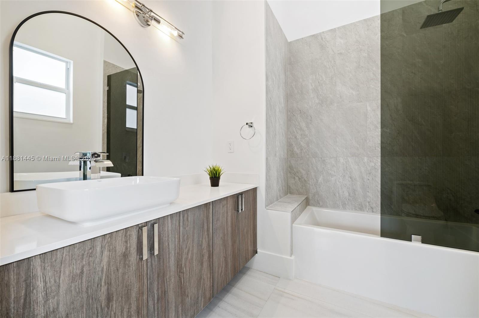 2400 Southwest 112th Avenue Davie, FL 33325 - Photo 39 of 61 a bathroom with a sink and a mirror