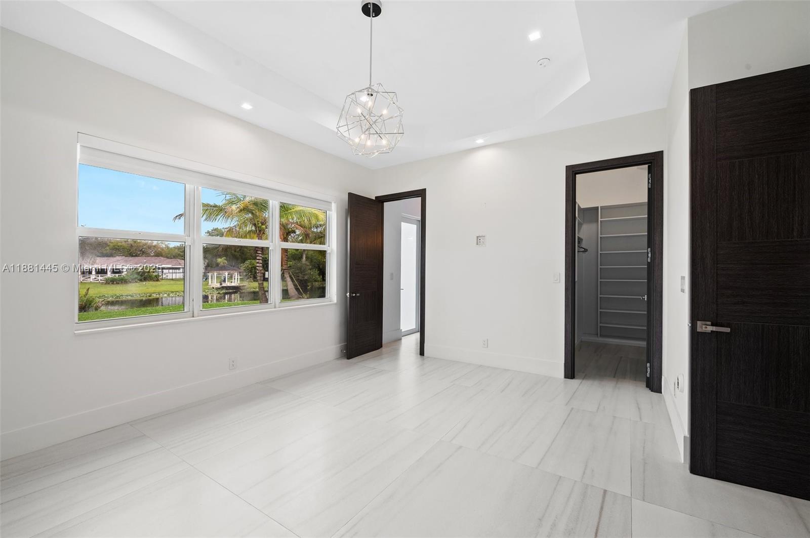 2400 Southwest 112th Avenue Davie, FL 33325 - Photo 40 of 61 a view of an empty room with a window