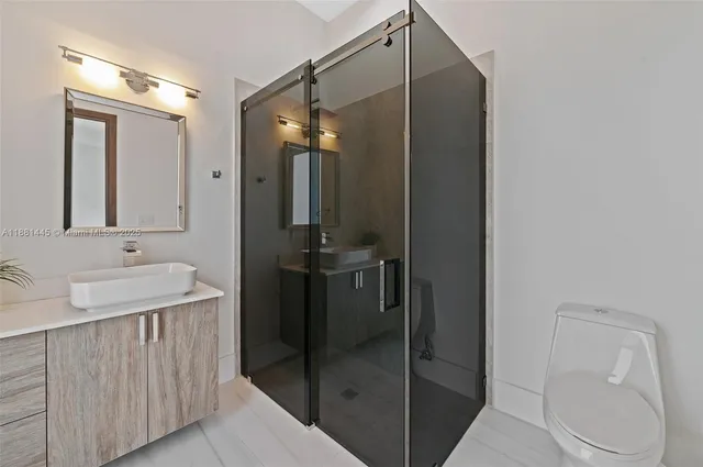 a view of a green field with wooden fence