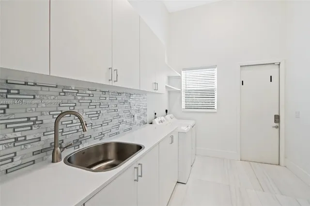 a aerial view of a house with swimming pool and garden