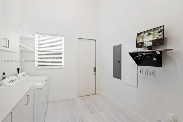 a view of a big house with a big yard and large trees