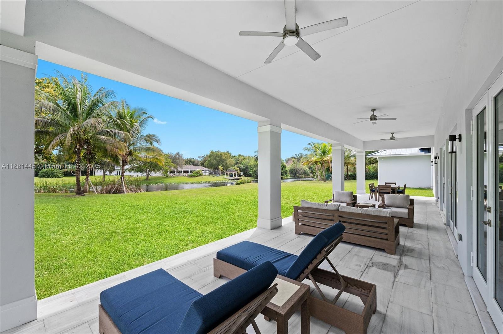 2400 Southwest 112th Avenue Davie, FL 33325 - Photo 45 of 61 784SF Covered Marble Tile Patio with 3 Ceiling Fans