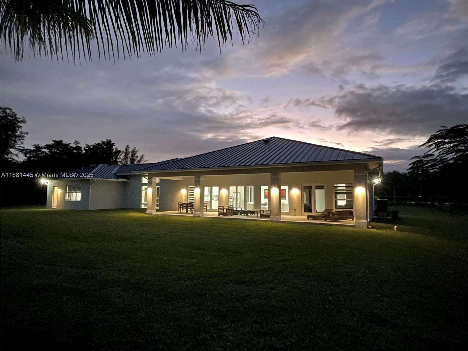 2400 Southwest 112th Avenue Davie, FL 33325 - Photo 47 of 61 a front view of a house with a garden