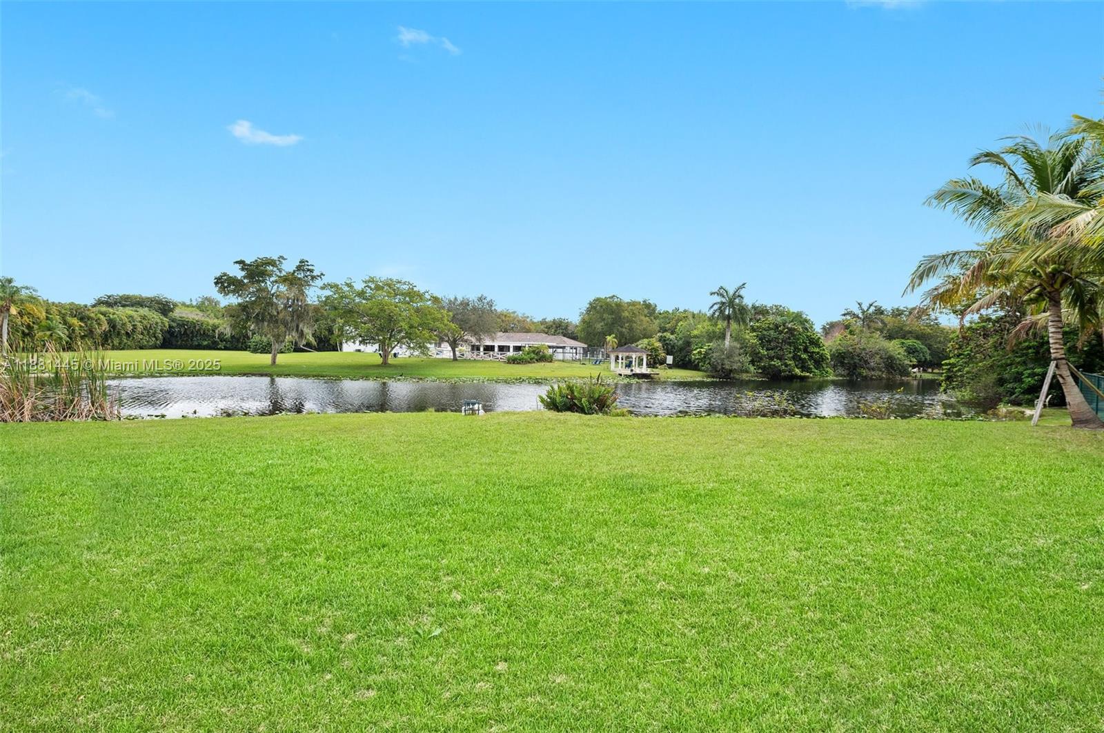 2400 Southwest 112th Avenue Davie, FL 33325 - Photo 48 of 61 a view of a green field with wooden fence