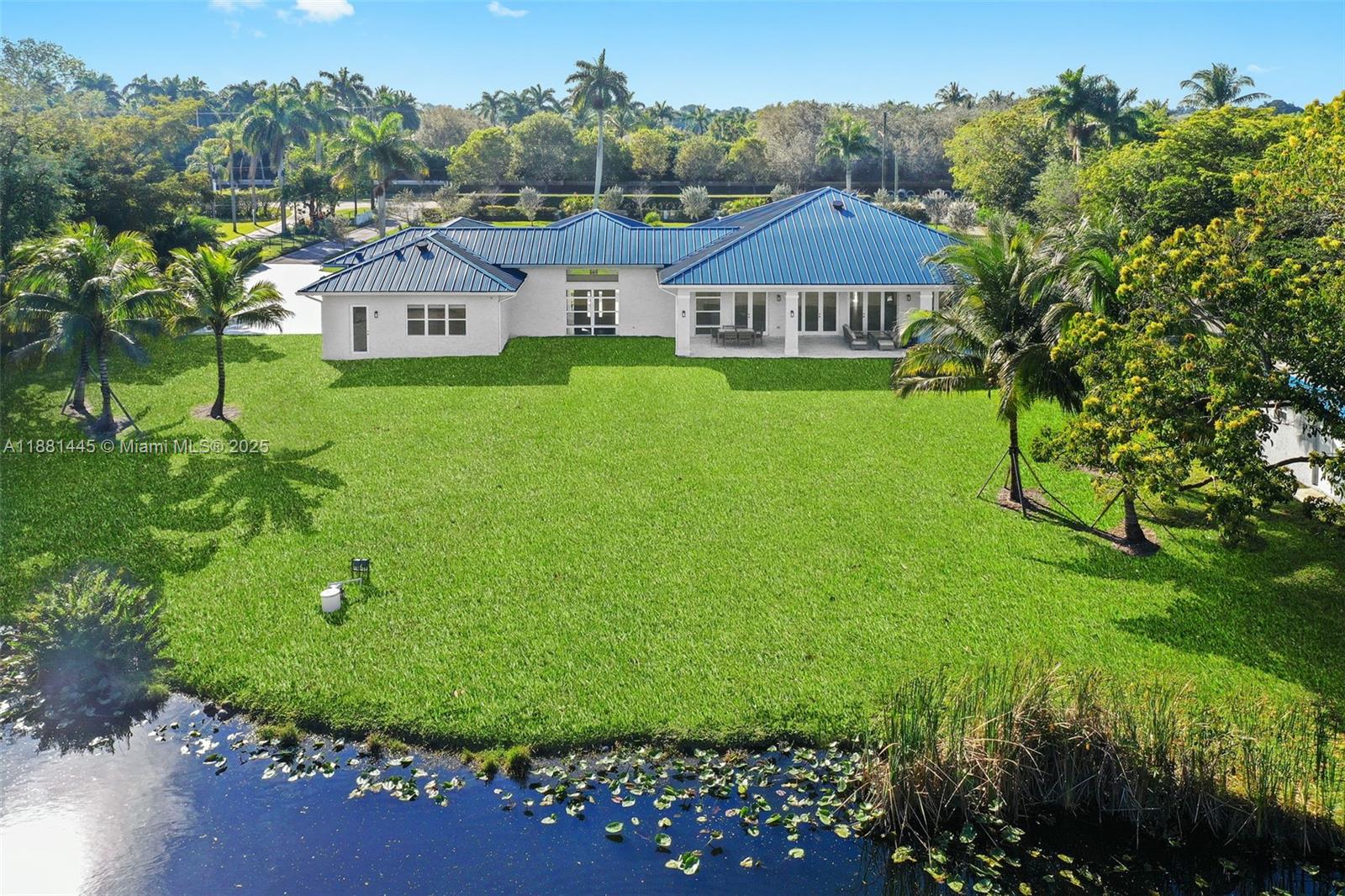 2400 Southwest 112th Avenue Davie, FL 33325 - Photo 49 of 61 a aerial view of a house with swimming pool and garden