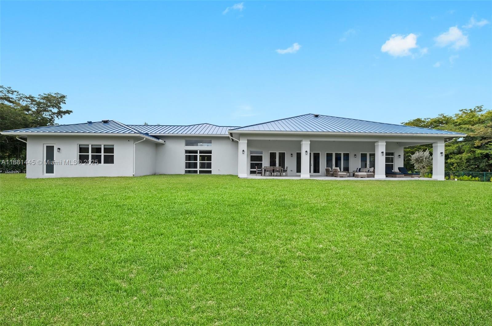 2400 Southwest 112th Avenue Davie, FL 33325 - Photo 51 of 61 a front view of house with a garden