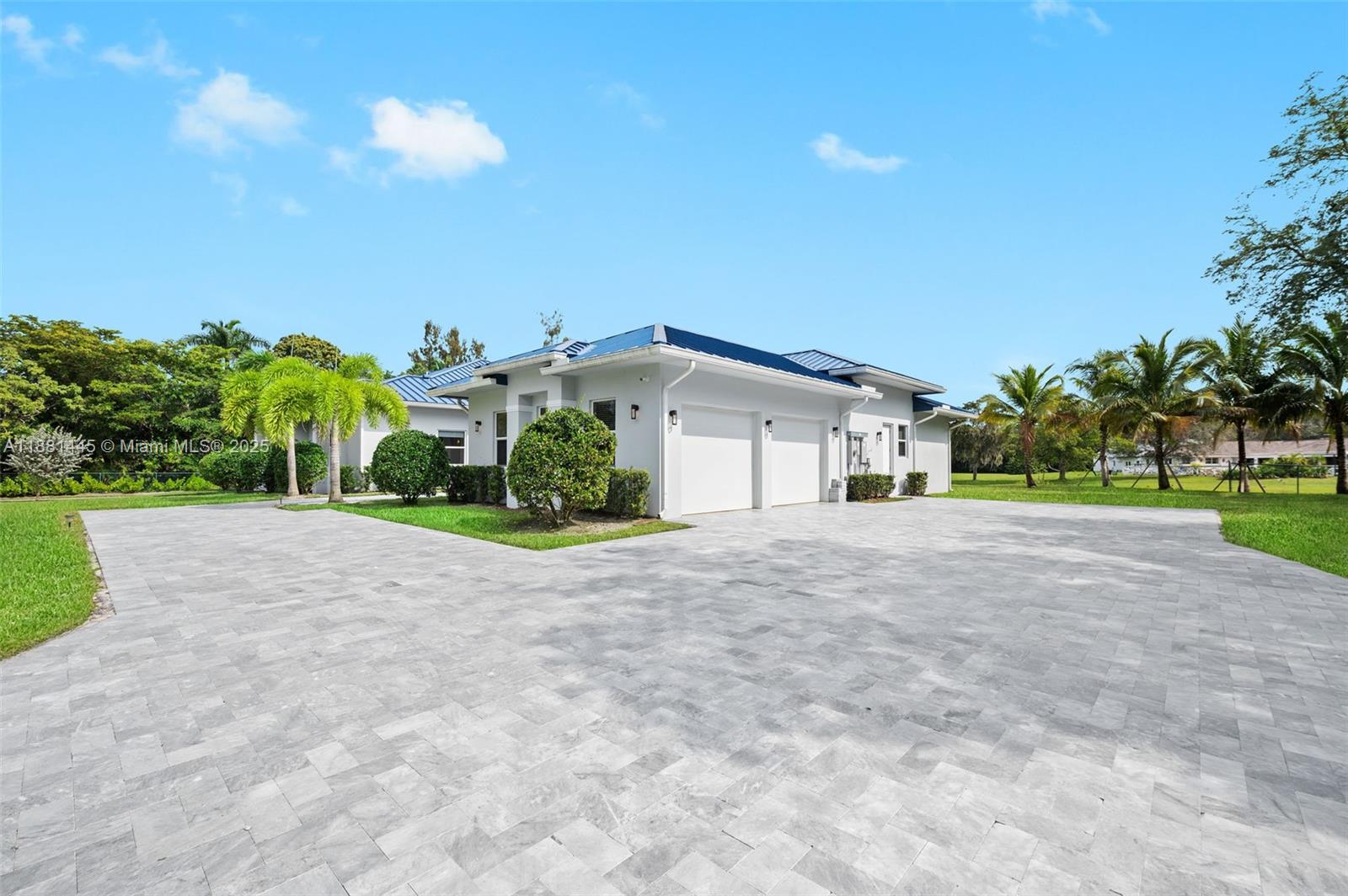 2400 Southwest 112th Avenue Davie, FL 33325 - Photo 7 of 61 a view of a house with a yard and garage
