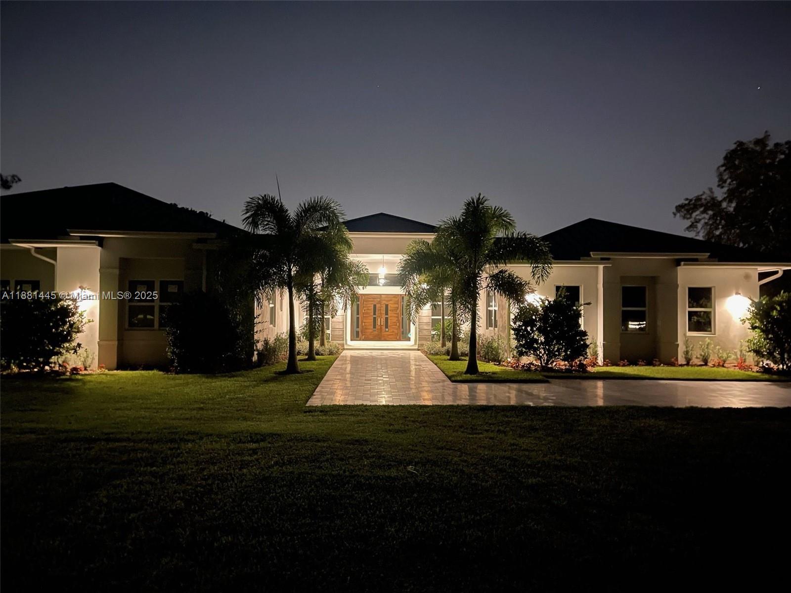 2400 Southwest 112th Avenue Davie, FL 33325 - Photo 8 of 61 a front view of a house with a yard