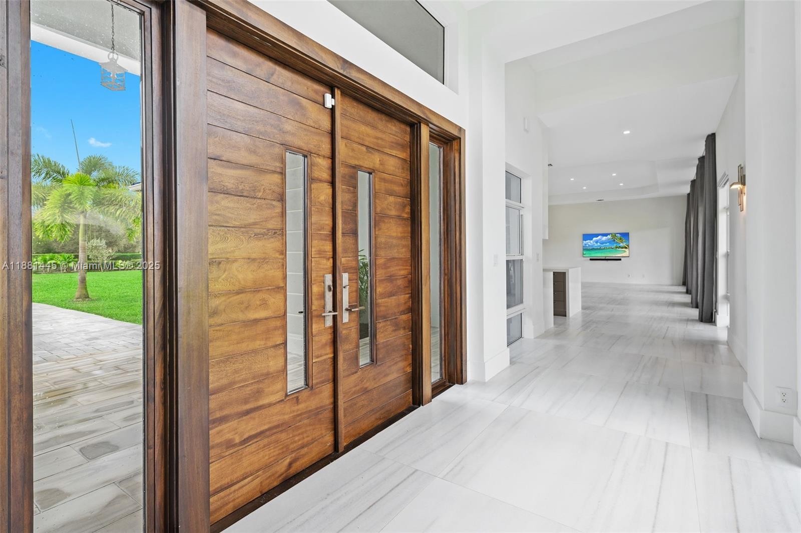 2400 Southwest 112th Avenue Davie, FL 33325 - Photo 10 of 61 a view of a hallway with wooden walls and entryway