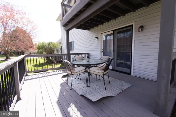 a view of balcony with furniture and wooden deck