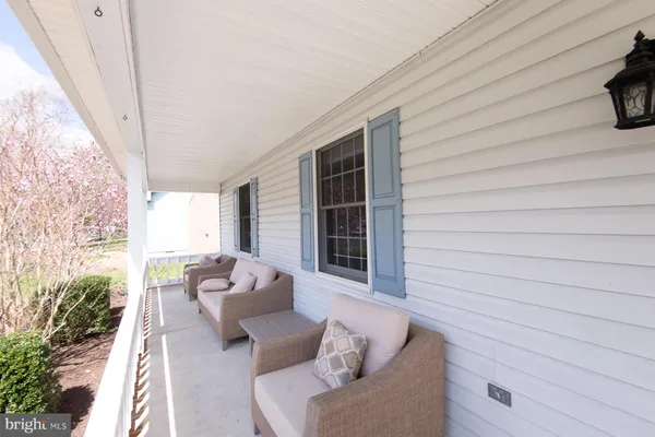 a view of balcony with furniture