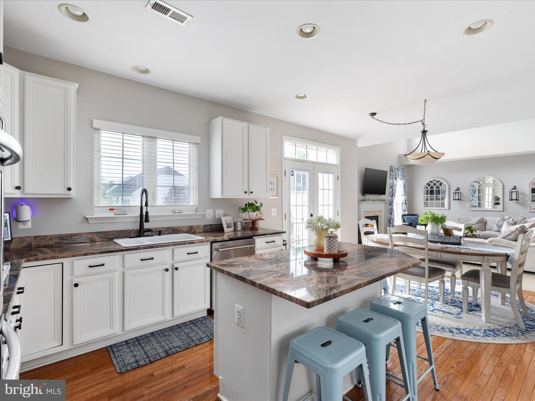8705 Lords View Loop Gainesville, VA 20155 - Photo 11 of 58 a kitchen with granite countertop lots of counter top space and stainless steel appliances