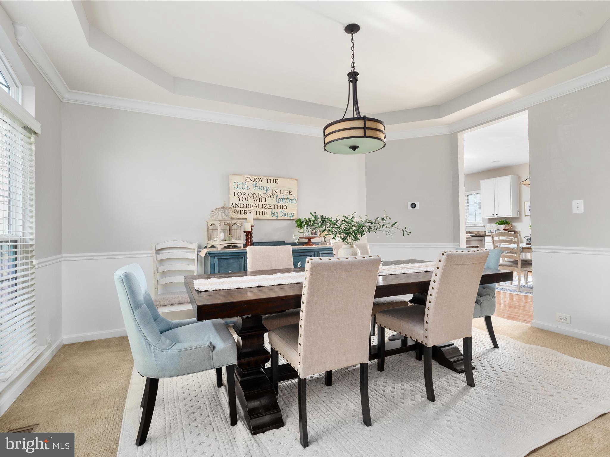 8705 Lords View Loop Gainesville, VA 20155 - Photo 2 of 58 a view of a dining room and a table and chairs