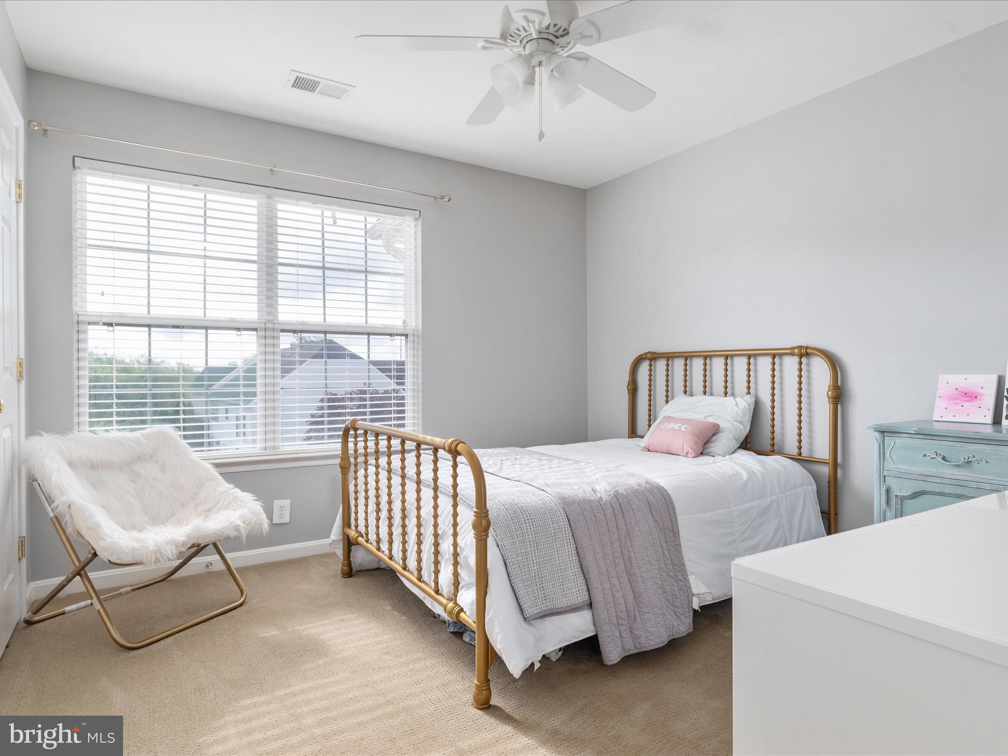 8705 Lords View Loop Gainesville, VA 20155 - Photo 24 of 58 a bedroom with two beds and a large window